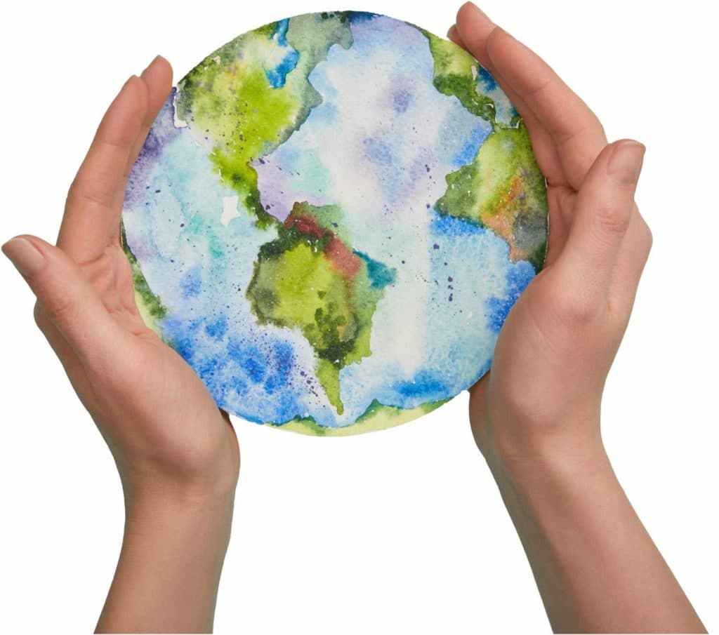 Hands holding a small globe over turquoise water — energy efficiency for Austin homes